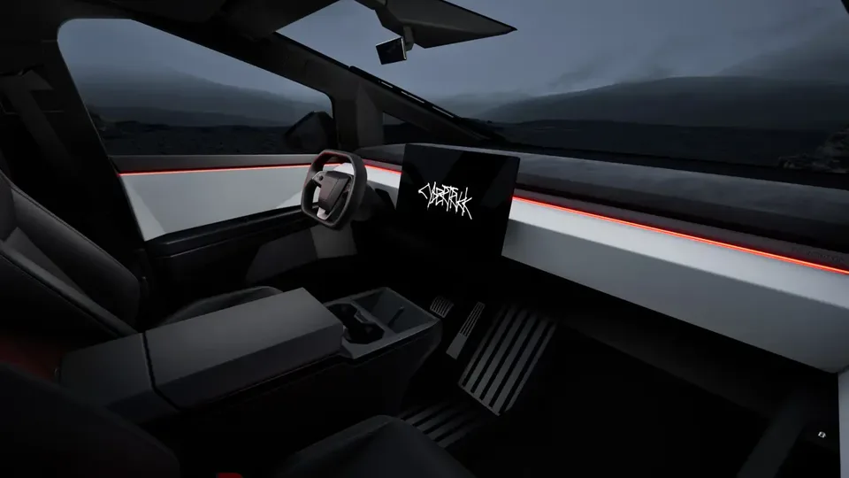 Elettronauti - Abitacolo anteriore della Tesla Cybertruck con plancia angolare e display centrale