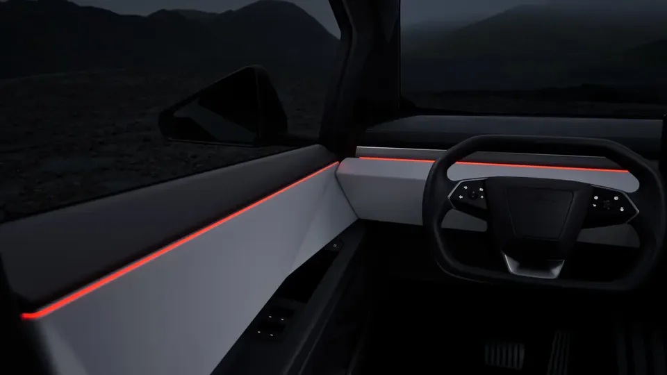 Elettronauti - Volante e plancia della Tesla Cybertruck con illuminazione d'accento rossa